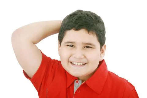 Young boy looking up with hand between the hair Stock Photos