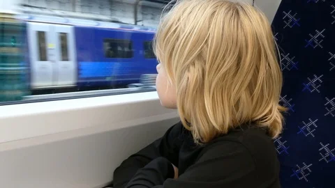 Young boy looking out of the train window. Stock Footage 113230806