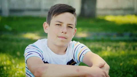 A young boy looks at the camera Stock Footage 90985412