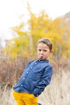 Young boy makes silly face at camera Stock Photos