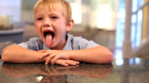 Young boy making funny faces Stock Footage 61660061
