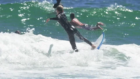 Young Boy Male Kid Practicing Surf Surfing Waves Ocean Video stock 219280392