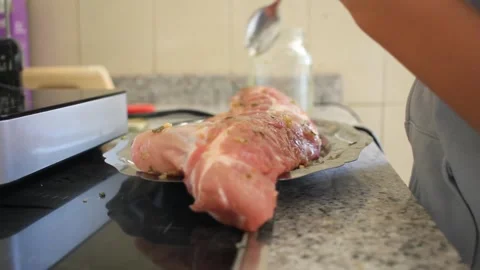 Young boy marinating pork meat , pork ribs Stock Footage 246833529