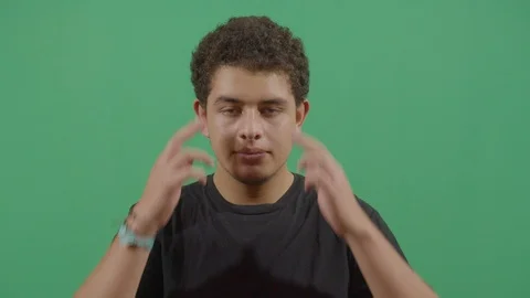 Young boy massaging the temples with eyes closed suggesting headache in ecuador 스톡 동영상 115339015