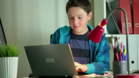 Young boy with modern laptop computer in home HD 스톡 동영상 29640019