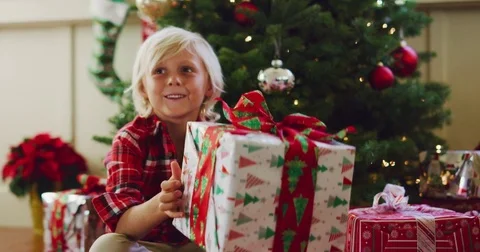 Young Boy Opening Christmas Presents Stock Footage 83323732