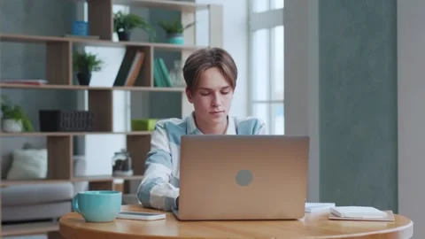 Young Boy Opening Laptop Computer and Typing Homework or Typing Education Text Stock Footage 243966159