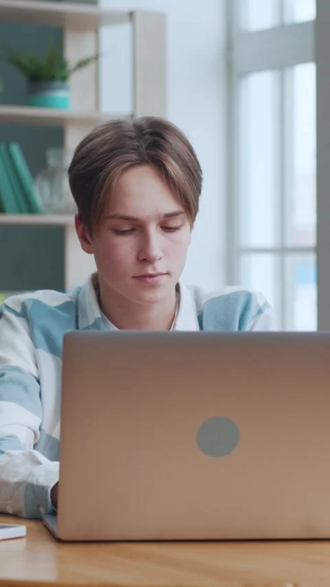 Young Boy Opening Laptop Computer and Typing Homework or Typing Education Text Stock Footage 306289035