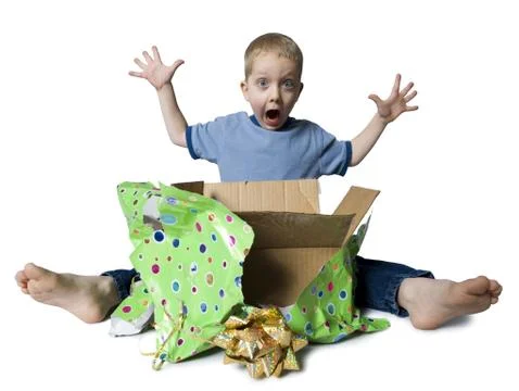 Young boy opening present Stock-Fotos