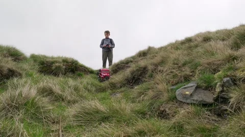 Young boy outdoors on the moors playing ... | Stock Video | Pond5