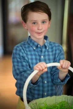 Young Boy Outside Dressed Up for Easter holding Basket Stock Photos