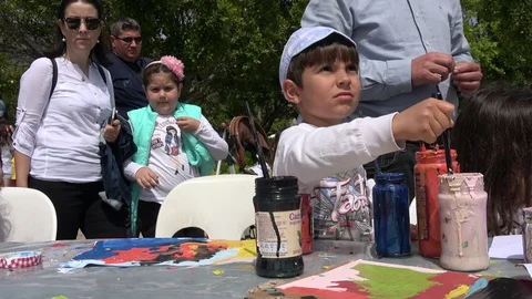 Young boy paints on the steet workshop 2 Stock Footage 107410761