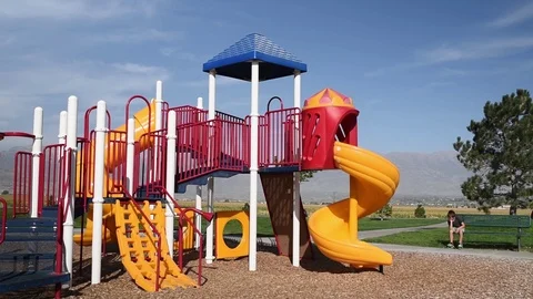Young boy at park playground by himself. 스톡 동영상 94930196