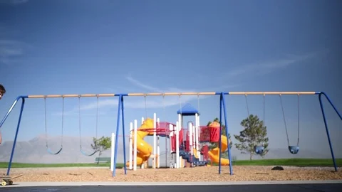 Young boy at a park trying to do skateboarding tricks. 스톡 동영상 94930319