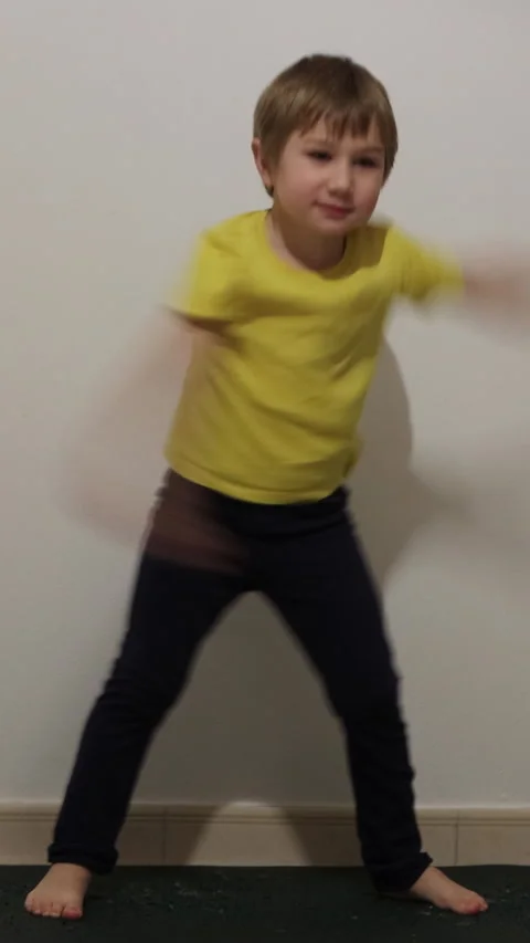 Young boy performing karate on exercise mat Stock Footage 326769908