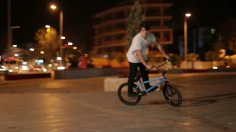  A young boy performs stunts on sport bike Stock Footage 62770865