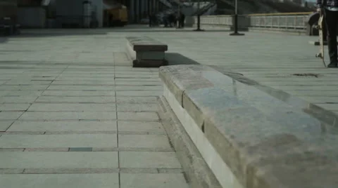 A young boy performs a trick on a skateboard Video stock 62947573