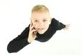 The young boy phone on the white background. View from above Photo