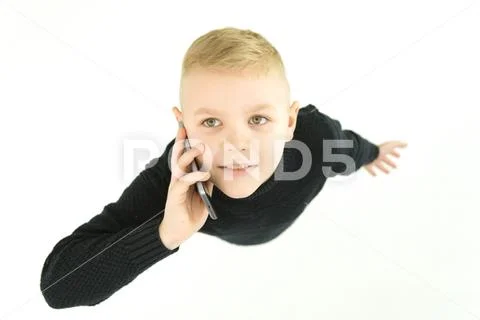 The young boy phone on the white background. View from above Stock Photos