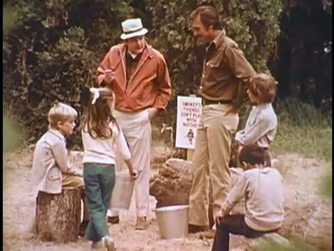 A young boy picks up his father's discarded match in the forest, and he and his Stock Footage