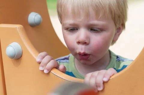 Young boy on playground Stock Photos