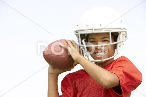 Young Boy Playing American Football Stock Photos