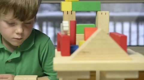 Young boy playing with blocks Stock Footage 43965387
