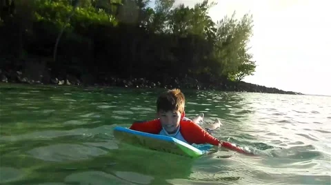 Young Boy Playing On Boogie Board In Hawaii Stock Footage 46219151