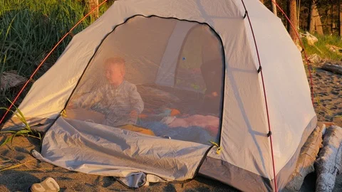 Young boy playing in camping tent. Stock Footage 97101283