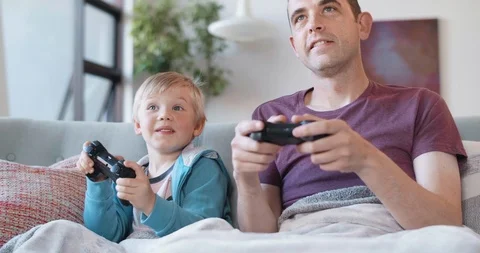 Young boy playing computer games with dad Stock Footage 120346876