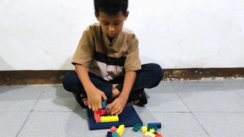 Young boy playing with educational toys Stock Footage 340594242