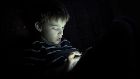 Young boy playing games on the tablet Stock Footage 84474327
