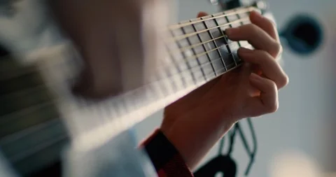 Young boy playing guitar in a classroom at school Stock Footage 108788043