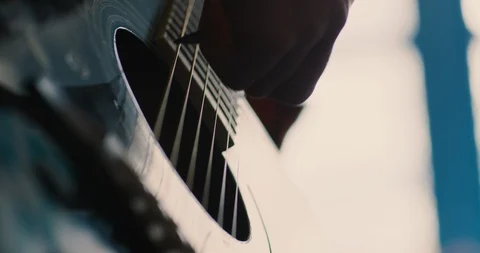 Young boy playing guitar in a classroom at school Stock Footage 108788402