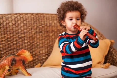 Young boy playing on instruments Stock Photos
