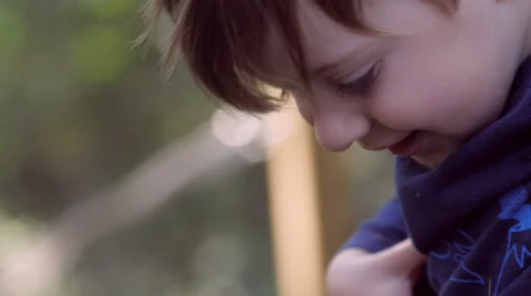 Young boy playing outside with father Stock Footage 48876014