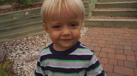 Young boy playing on a patio Video stock 65240886