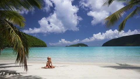 Young boy playing in the sand at perfect tropical beach, maho bay, st john Stock Footage 76495018