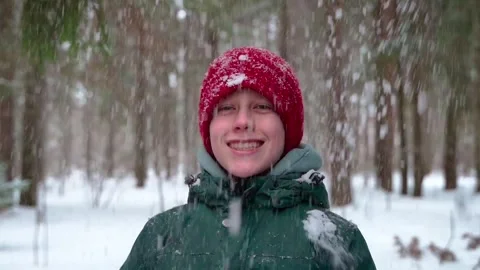 Young boy playing with snow and smiling Stock Footage 265791353