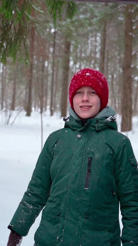 Young boy playing with snow and smiling Stock Footage 265791356