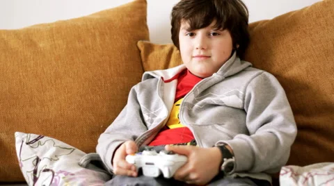 Young boy playing videogames Stock Footage 918546