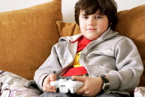 Young boy playing videogames Stock Footage 918571