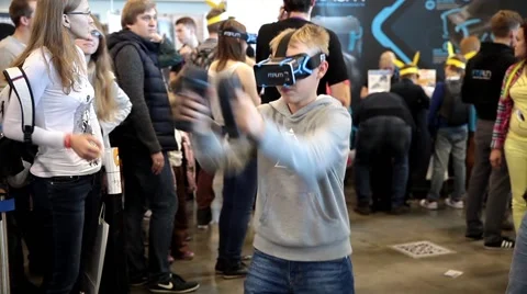 Young boy playing with virtual reality glasses. Virtual reality game. Stock Footage 55456866