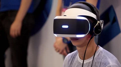 Young boy playing with virtual reality glasses. Virtual reality game. Stock Footage 55694014