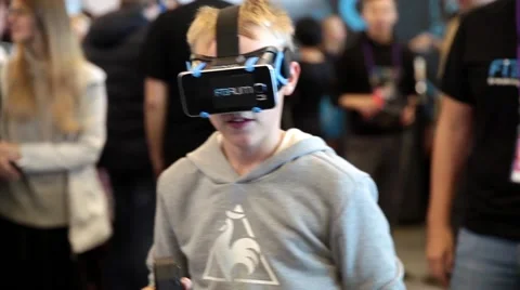 Young boy playing with virtual reality glasses. Virtual reality game. Stock Footage 58890020