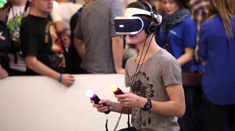 Young boy playing with virtual reality glasses in Game center. Stock Footage 59547079