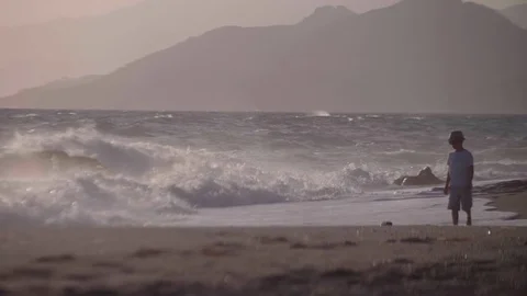 Young Boy Playing With Waves Stock Footage 80271616