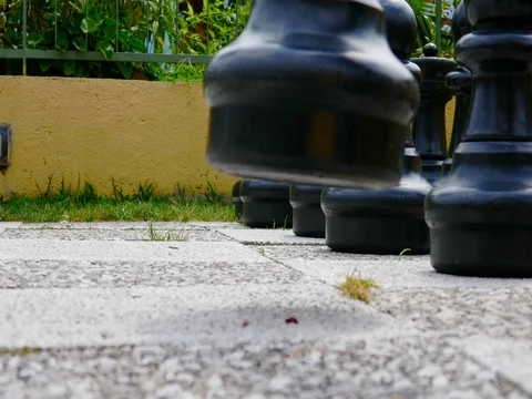 Young boy plays in big chess 3 Stock Footage 78356633