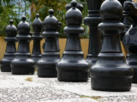 Young boy plays in big chess Stock Footage 78356800