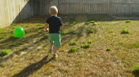 Young boy plays chase 1 - slow motion Video stock 22346396